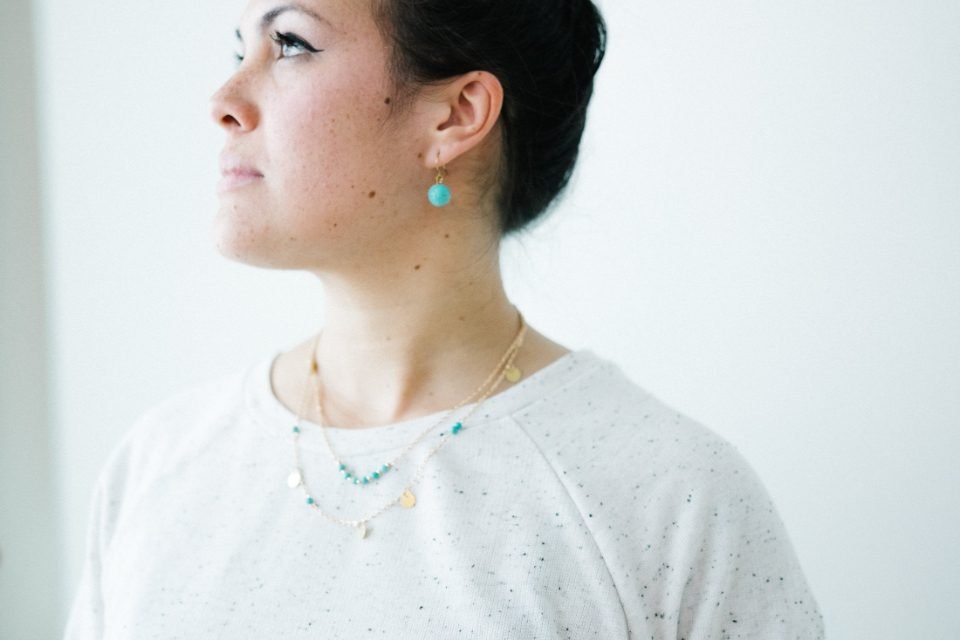 Woman wearing delicate silver jewellery